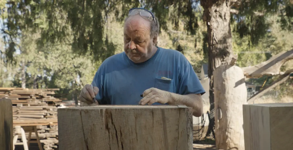 Photo of man marking wood