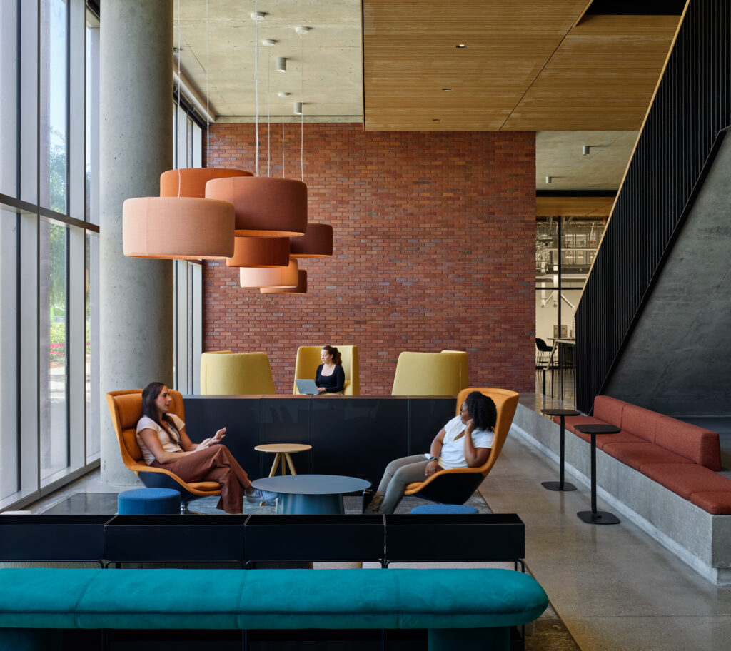 people meeting in lobby at 300 aggie square