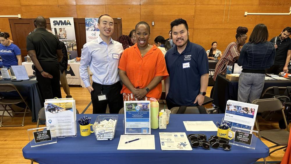 Andrew, Dreya, Touyee (left to right) pose for a photo at the UC Davis Health table. Photo courtesy of Dreay DeShazier Yin.