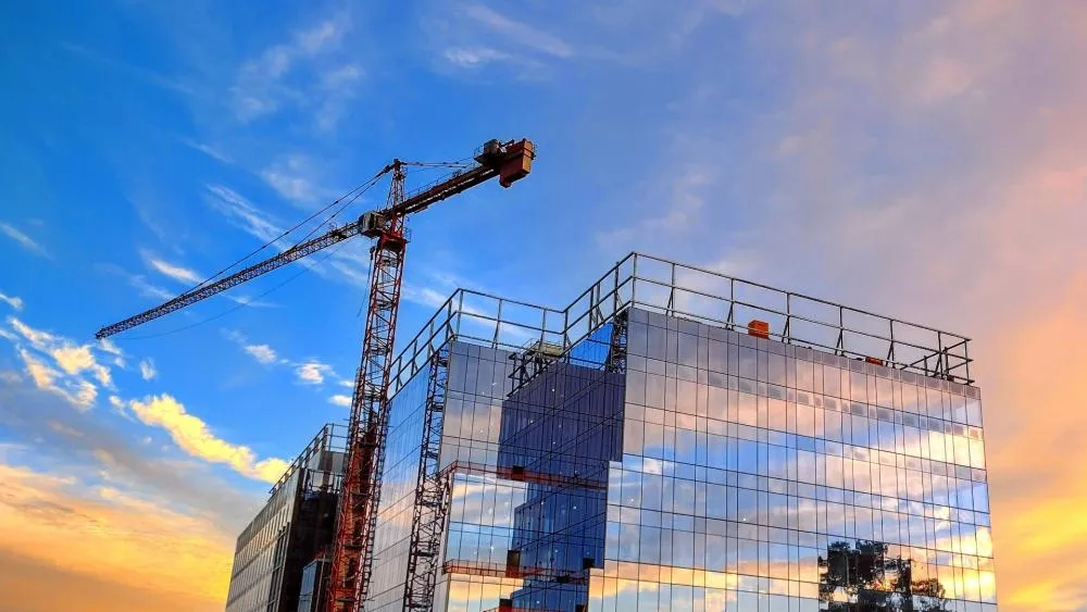 November 2023's first place winner showcases the Aggie Square crane in front of a beautiful sunrise sky. Photo by Paul Hobson.