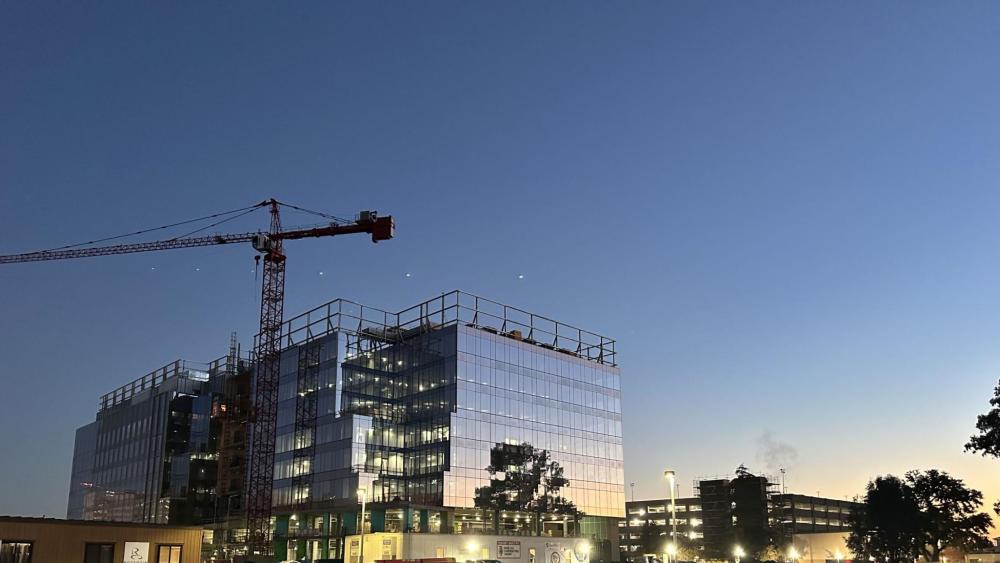The second place winner for December 2023 showcases the beautiful glass on the Aggie Square buildings, reflecting the first rays of sunlight. Photo by Doc Parker.