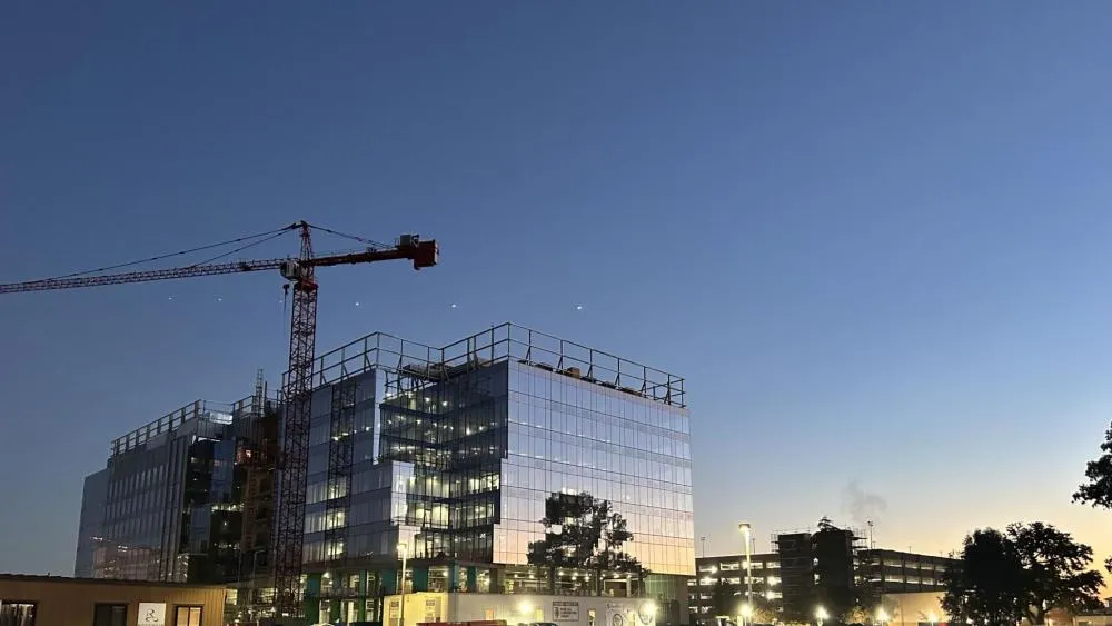 The second place winner for December 2023 showcases the beautiful glass on the Aggie Square buildings, reflecting the first rays of sunlight. Photo by Doc Parker.