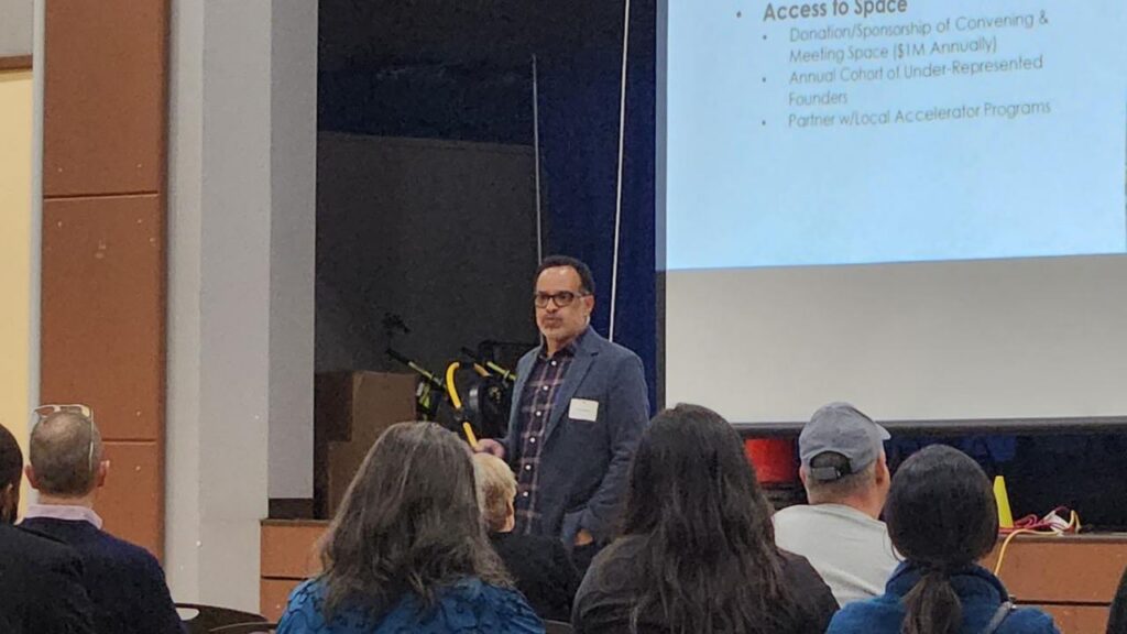 speaker presenting to a crowd