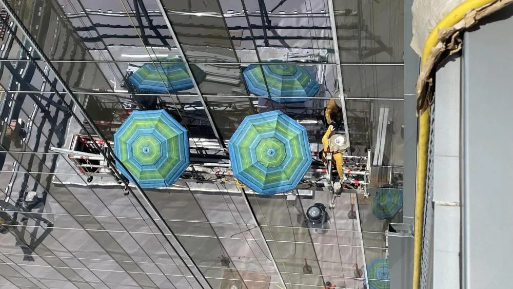 May 2024's first-place winner features beach umbrellas used by the construction workers to stay out of the sunlight during the heat. Photo by Jordan Levin.