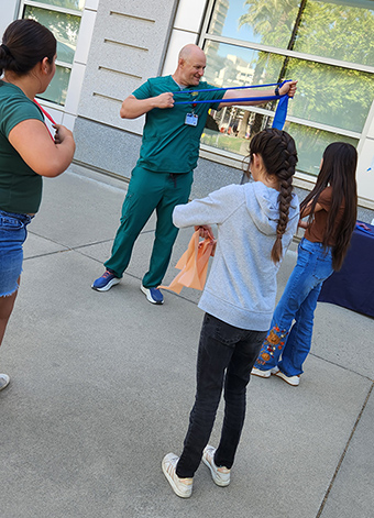 The students watch a demonstration by Physical Medicine and Rehabilitation.