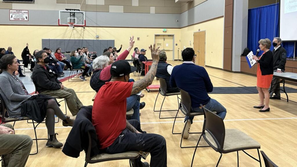 Leslie Fritzsche, city of Sacramento's economic investment manager, answers questions from attendees at Aggie Square's community engagement meeting on housing development and assistance programs.