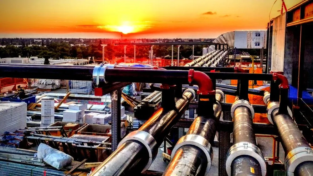 The first place winning photo for October 2023 captures the sunrise atop an Aggie Square building. Photo by Paul Hobson.