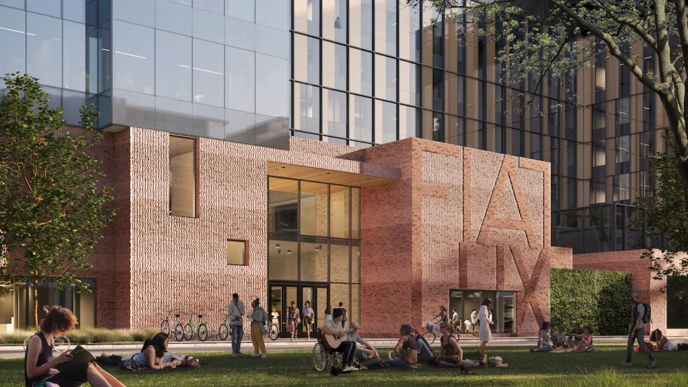 Fiat Lux, the University of California motto, appears in letters two-stories high on the side of Aggie Square, spell out in local bricks.