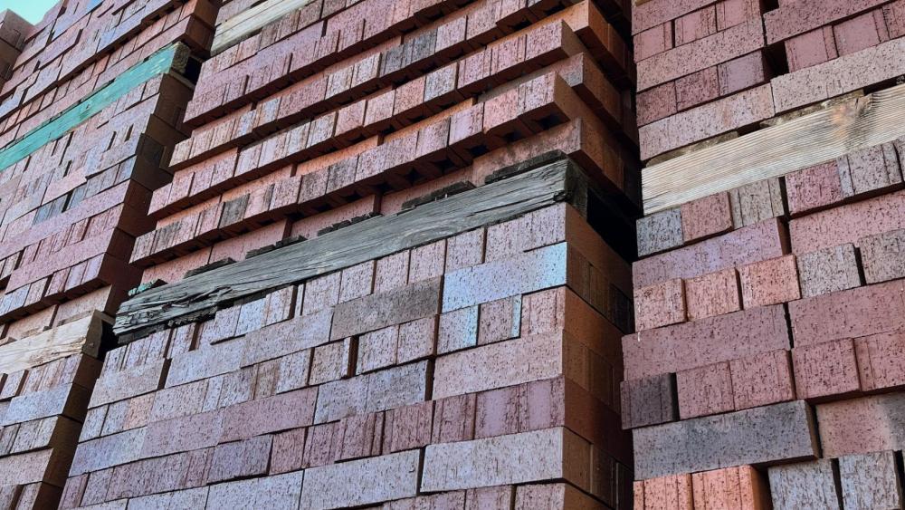Pallets of Aggie Square bricks manufactured by H.C. Muddox in Sacramento.