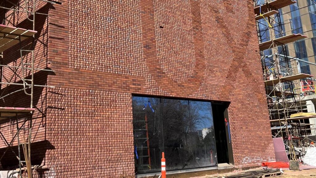 building of aggie square. fiat lux bricks.