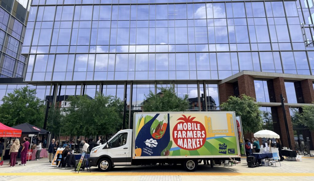 A truck with a sign that reads 
